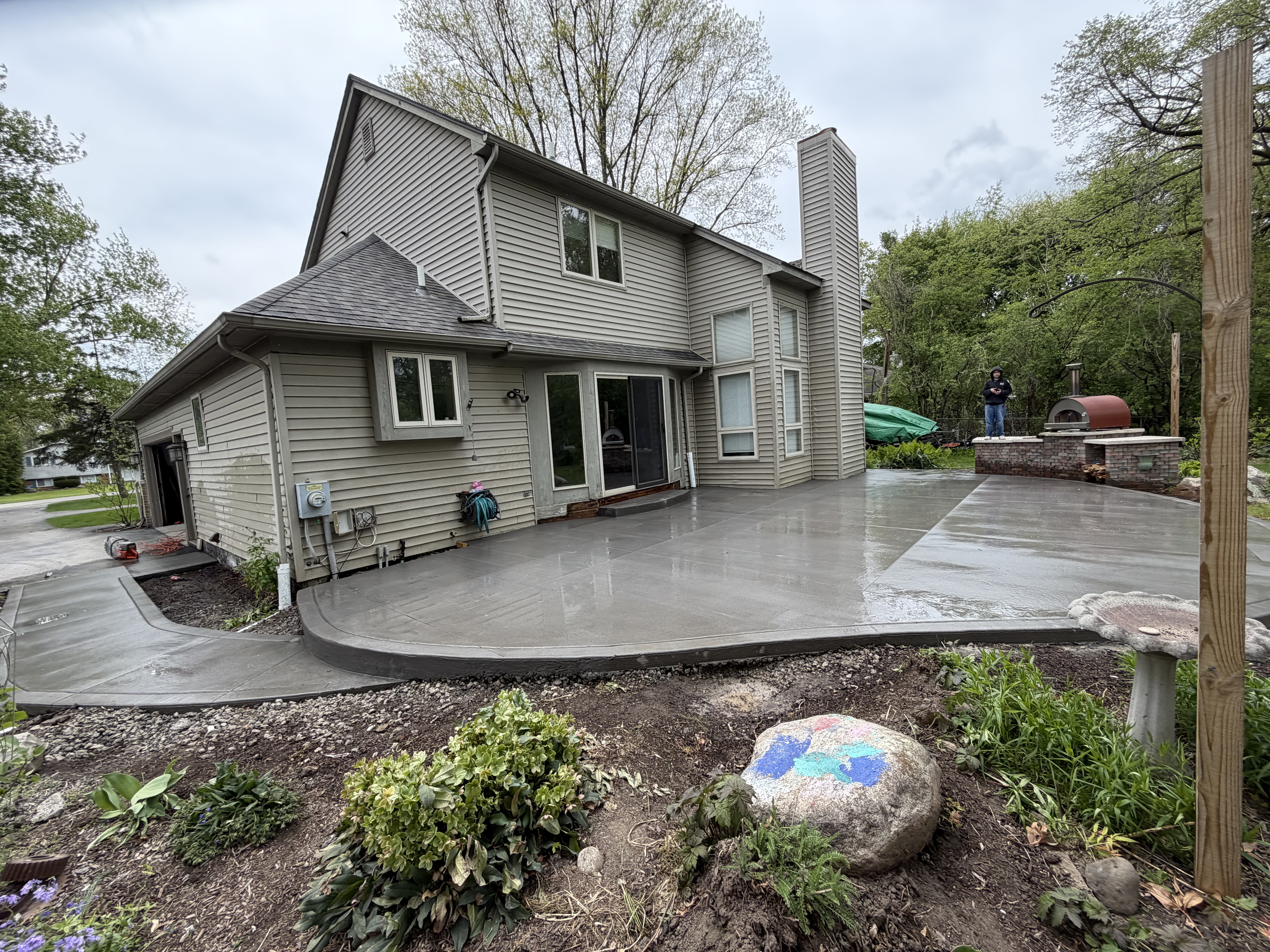 Large integral colored patio with curved edges