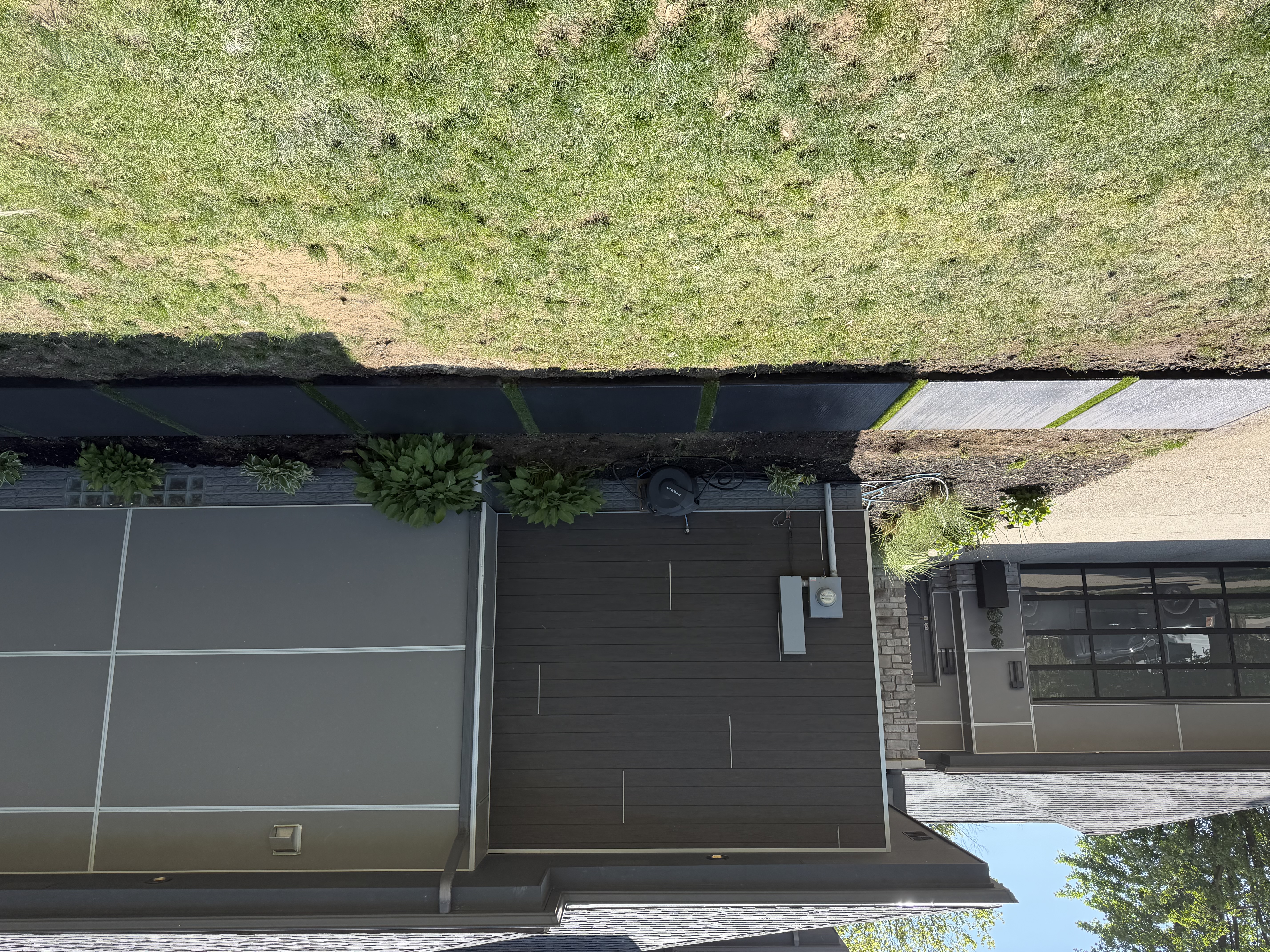 Black colored concrete walkway pads with turf strips in Troy MI