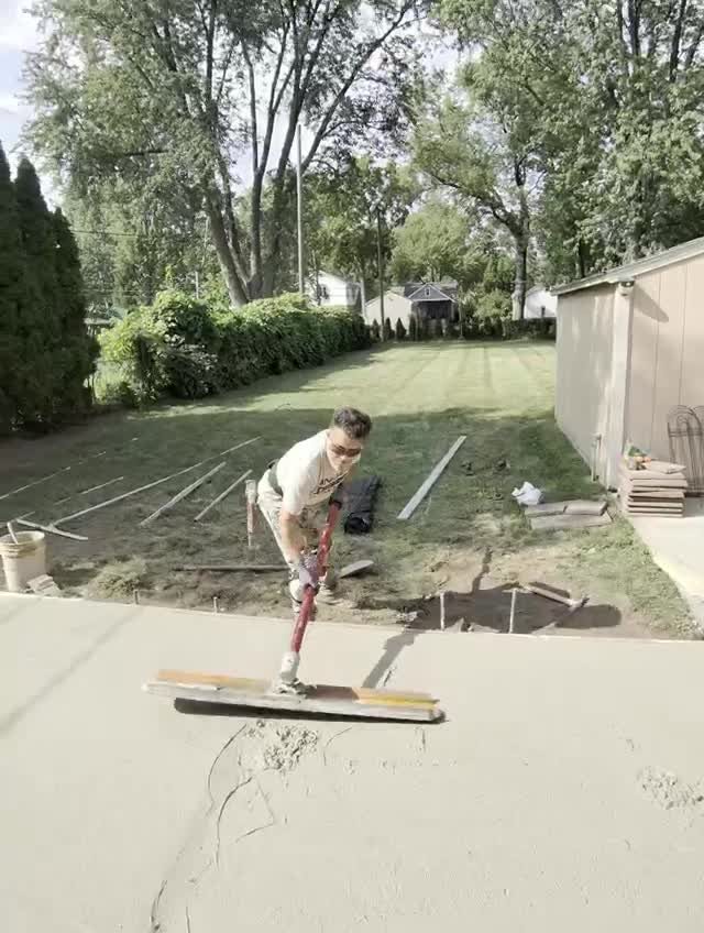 Bull float pass on a freshly poured patio in Berkley MI